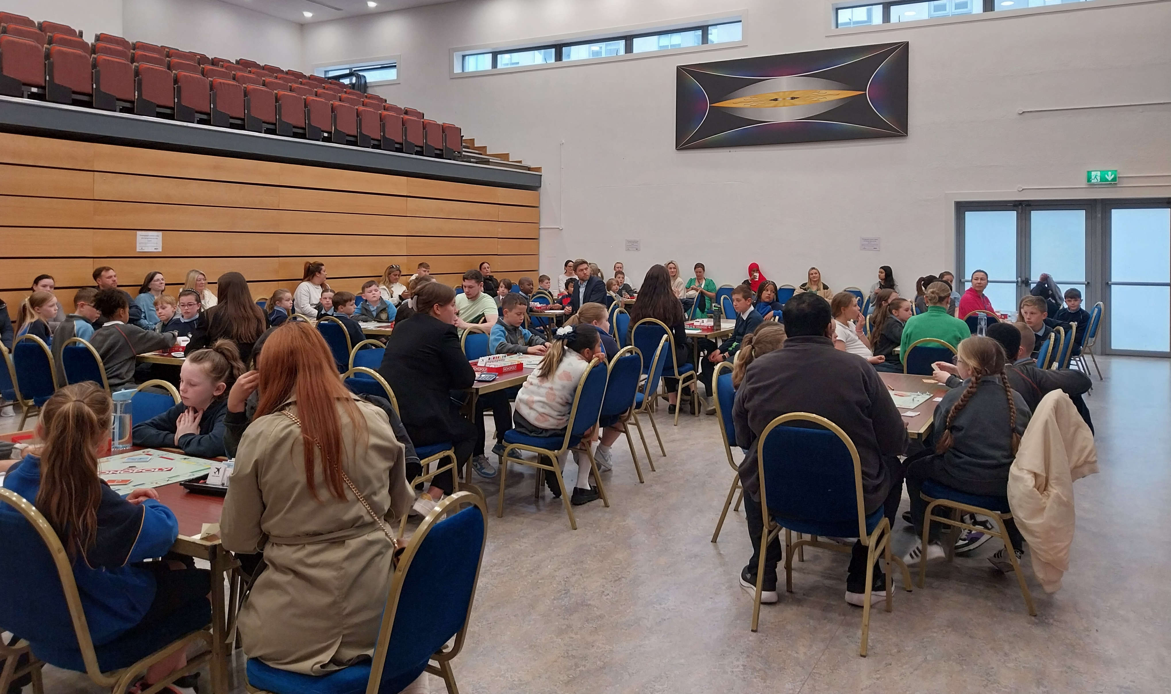 Children-caregivers-play-monopoly-tournament-community-center